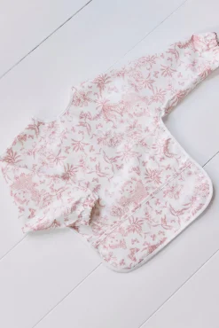 Bavoir à manches toile enduite Imprimé inspiration Toile de Jouy rose